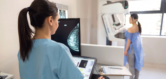 mammogram tech and patient