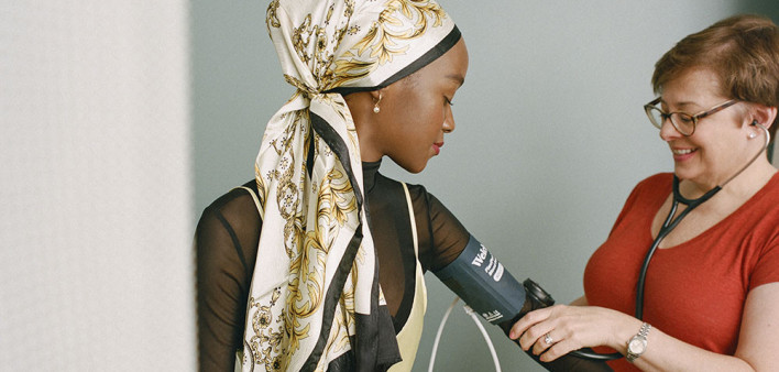 blood pressure Muslim woman doctor stethoscope