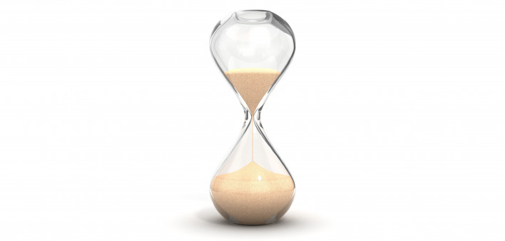 an hourglass with sand running downwards