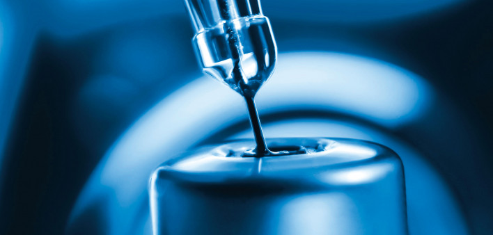 vaccine needle going into syringe