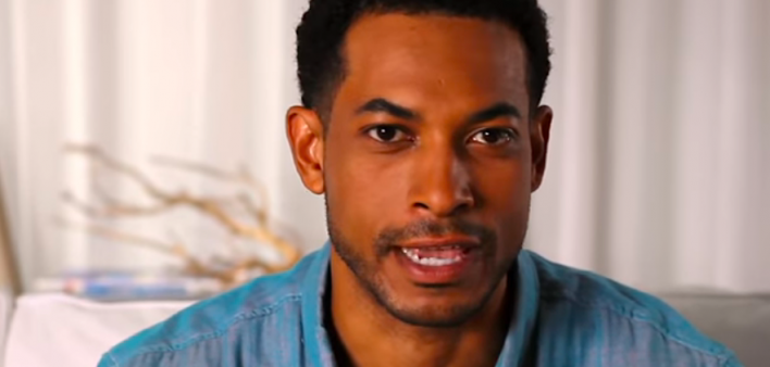 A scene from the how-to video on taking an OraQuick in-home HIV test