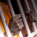 Prison Prisoner Prison Reform hands on bars
