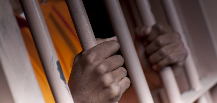 Prison Prisoner Prison Reform hands on bars