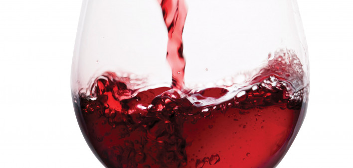 red wine pouring into glass