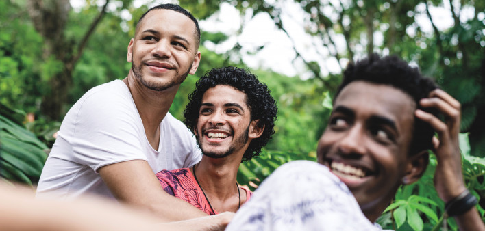 Gay friends having a good time at public park