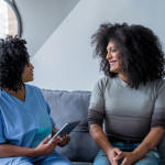 two women talking and laughing