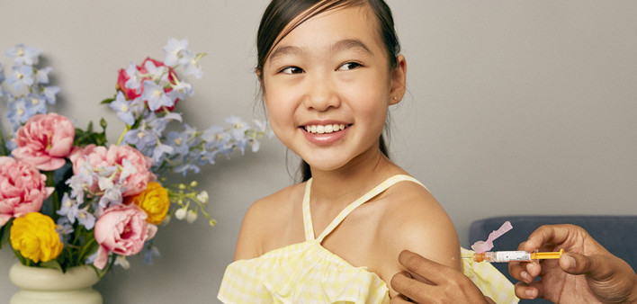girl receives vaccine