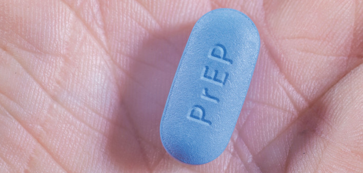 and hold blue pill with PrEP written
