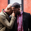 Same sex couple posing in New York city streets