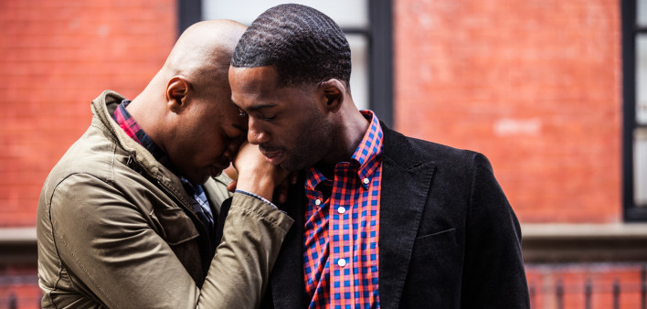 Same sex couple posing in New York city streets