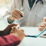Doctor talking to the patient about menopause and treatment in future.
