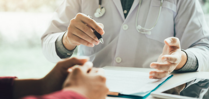 Doctor talking to the patient about menopause and treatment in future.
