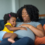pregnant mother and young girl