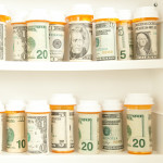 pill bottles with money as labels cost of healthcare