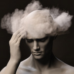 Brain Fog A make figure with his right hand on his temple pained expression