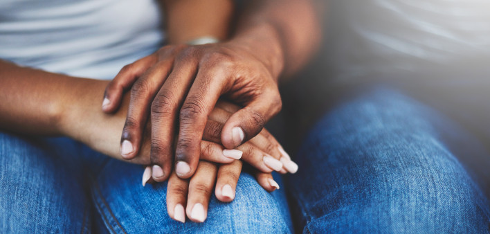ethnic black latino man and woman holding hands