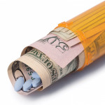 blue pills money pill bottle healthcare cost