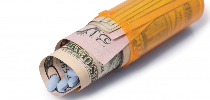 blue pills money pill bottle healthcare cost