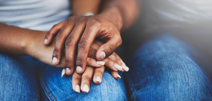 ethnic black latino man and woman holding hands
