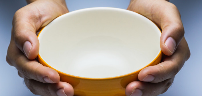 hands holding empty bowl