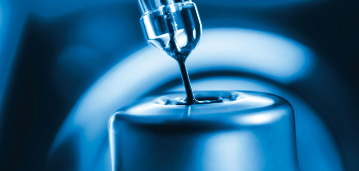 vaccine needle going into syringe