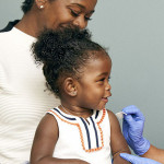 little girl and mother vaccine