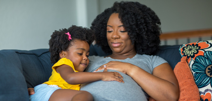pregnant mother and young girl