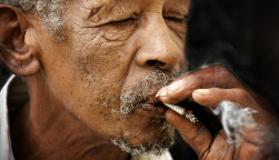 old man smoking a joint