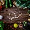 A table of food with a drawing of a liver