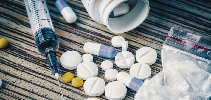 syringe and pills