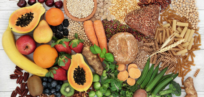 food with high fiber content for a healthy diet with fruit, vegetables, whole wheat bread, pasta, nuts, legumes, grains and cereals