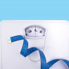 scale and blue tape measure weight