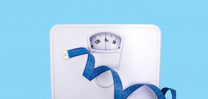 scale and blue tape measure weight