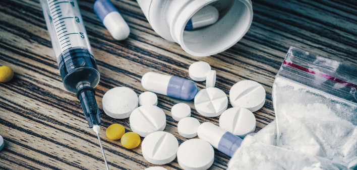 syringe and pills