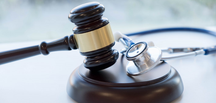 Gavel and stethoscope. medical jurisprudence. legal definition of medical malpractice. attorney. common errors doctors, nurses and hospitals make