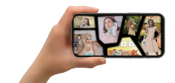 hand with phone and Oraquick: The Musical