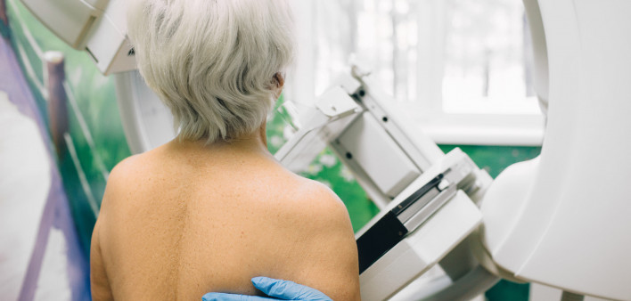 Senior woman having a mammography scan at hospital