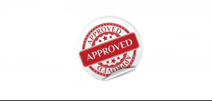 A red and white seal of "Approval"