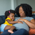 pregnant mother and young girl