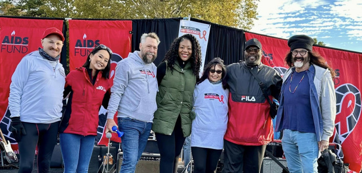 Emcees and event leaders on stage at AIDS Walk Philly 2023