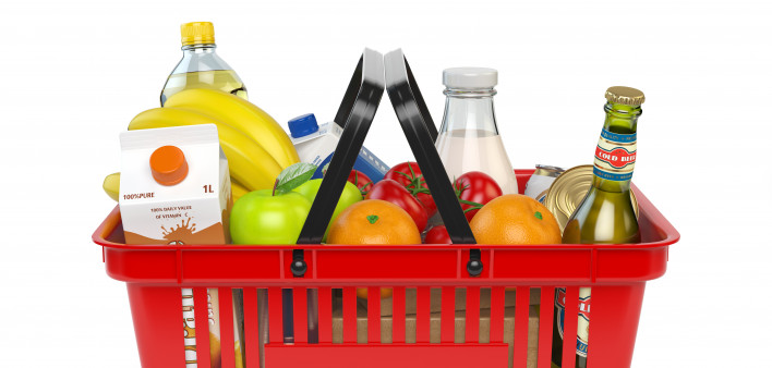 Shopping basket with variety of grocery products