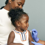 little girl and mother vaccine