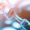 syringe in vial vaccine