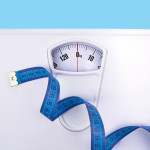 scale and blue tape measure weight