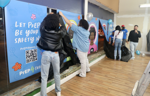 Youth unveiling the first PrEP4Teens mural they helped create at TaskForce in Chicago
