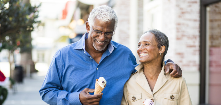 A senior african american couple enjoy an evening on the town with ice cream