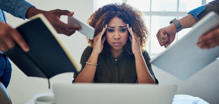 Shot of a stressed out young woman working in a demanding career