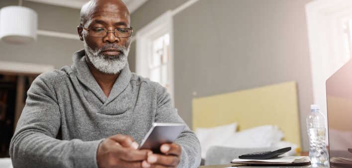 Smart apps make for smart budgeting senior black man with phone