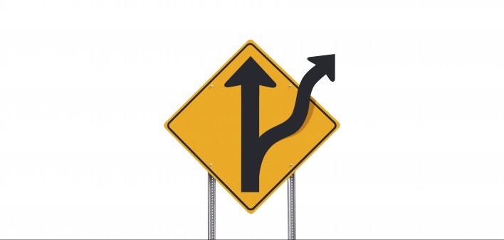 road sign showing road divides ahead