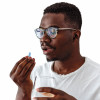 Black man taking a blue pill